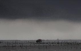 Rain Clouds Gather Over A Cottage In Chonburi/