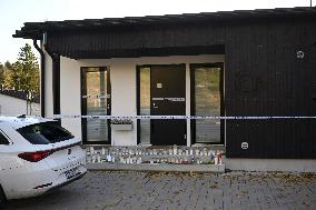 Police tape and candles at Janne Puhakka's residence