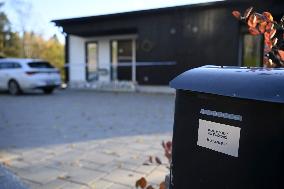 Police tape and candles at Janne Puhakka's residence