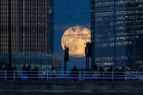 Full Moon Rises Over The Financial District - London