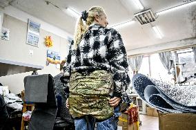 Zaporizhzhia volunteers make anti-thermal imaging ponchos for military