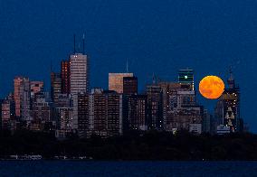 Full Moon Rises Over The Skyline In Toronto