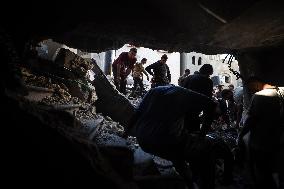 Palestinians Inspect Buildings Bombed