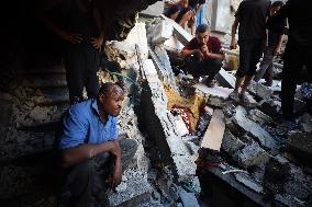 Palestinians Inspect Buildings Bombed