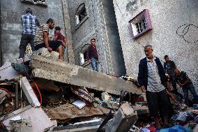 Palestinians Inspect Buildings Bombed