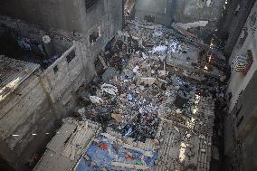 Palestinians Inspect Buildings Bombed