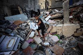 Palestinians Inspect Buildings Bombed