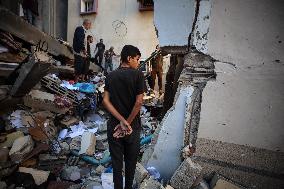 Palestinians Inspect Buildings Bombed