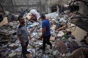 Palestinians Inspect Buildings Bombed