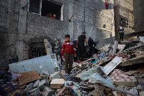 Palestinians Inspect Buildings Bombed