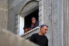 Palestinians Inspect Buildings Bombed