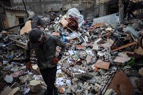 Palestinians Inspect Buildings Bombed