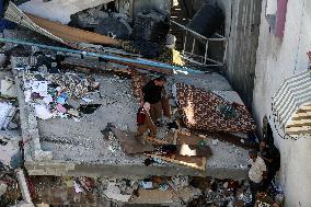 Palestinians Inspect Buildings Bombed