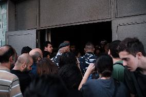 Lebanese military attempts to evacuate displaced people from a Beirut building