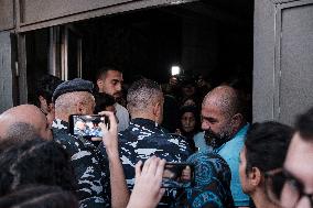 Lebanese military attempts to evacuate displaced people from a Beirut building