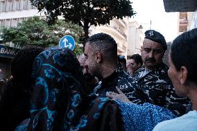 Lebanese military attempts to evacuate displaced people from a Beirut building