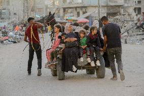 Displaced Palestinians Leave School In Beit Lahia - Gaza