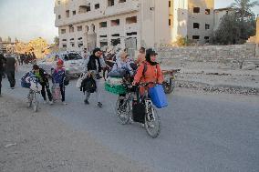 Displaced Palestinians Leave School In Beit Lahia - Gaza