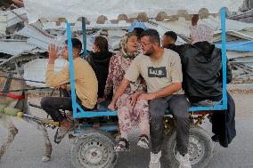 Displaced Palestinians Leave School In Beit Lahia - Gaza