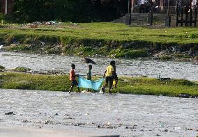 Children Catches Fish In Mahananda