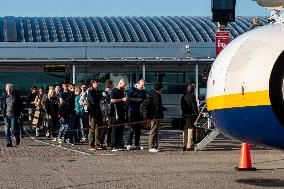 Passengers Boarding A Ryanair Aircraft Of The Low Cost Carrier