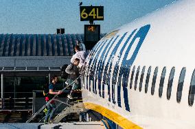 Passengers Boarding A Ryanair Aircraft Of The Low Cost Carrier