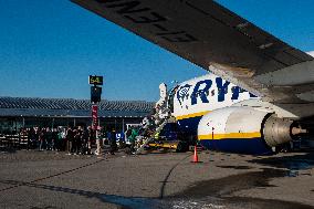 Passengers Boarding A Ryanair Aircraft Of The Low Cost Carrier