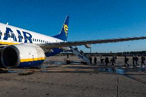 Passengers Boarding A Ryanair Aircraft Of The Low Cost Carrier