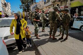 Settlers Storm The Old City Of Hebron - West Bank