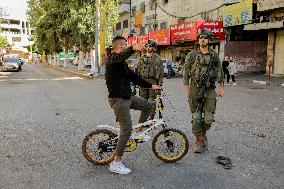 Settlers Storm The Old City Of Hebron - West Bank