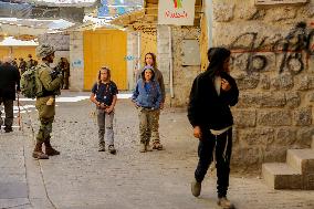 Settlers Storm The Old City Of Hebron - West Bank