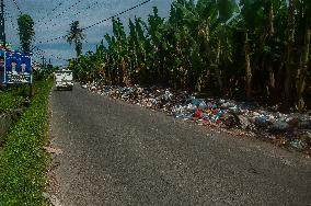 Plastic Waste Is Scattered On The Side Of A Road - Indonesia