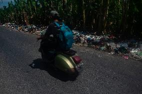 Plastic Waste Is Scattered On The Side Of A Road - Indonesia