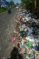 Plastic Waste Is Scattered On The Side Of A Road - Indonesia