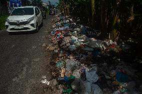 Plastic Waste Is Scattered On The Side Of A Road - Indonesia