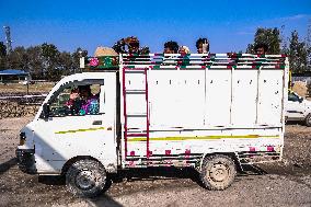 Non-Local Labourers Work At A Construction Site In Kashmir