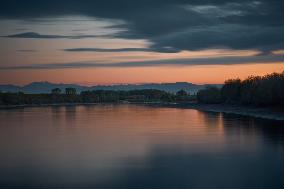 Po River At Sunset, Italy's Longest River In Golden Hour