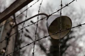 A Detail Of The Wire Fence Of The Nazi Concentration Camp Of Dachau