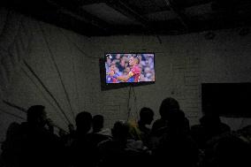 People Watch Football During Conflict In Bureij Camp - Gaza