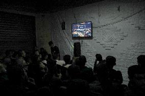 People Watch Football During Conflict In Bureij Camp - Gaza