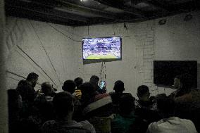 People Watch Football During Conflict In Bureij Camp - Gaza