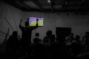 People Watch Football During Conflict In Bureij Camp - Gaza