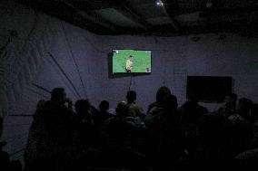 People Watch Football During Conflict In Bureij Camp - Gaza