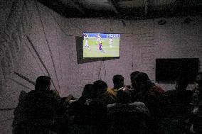 People Watch Football During Conflict In Bureij Camp - Gaza