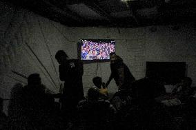 People Watch Football During Conflict In Bureij Camp - Gaza