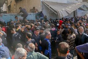 Displaced Palestinians Queue To Buy Bread - Gaza