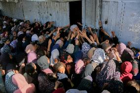 Displaced Palestinians Queue To Buy Bread - Gaza