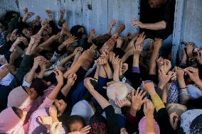 Displaced Palestinians Queue To Buy Bread - Gaza