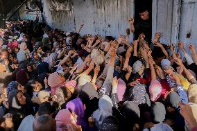 Displaced Palestinians Queue To Buy Bread - Gaza