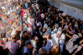 Displaced Palestinians Queue To Buy Bread - Gaza